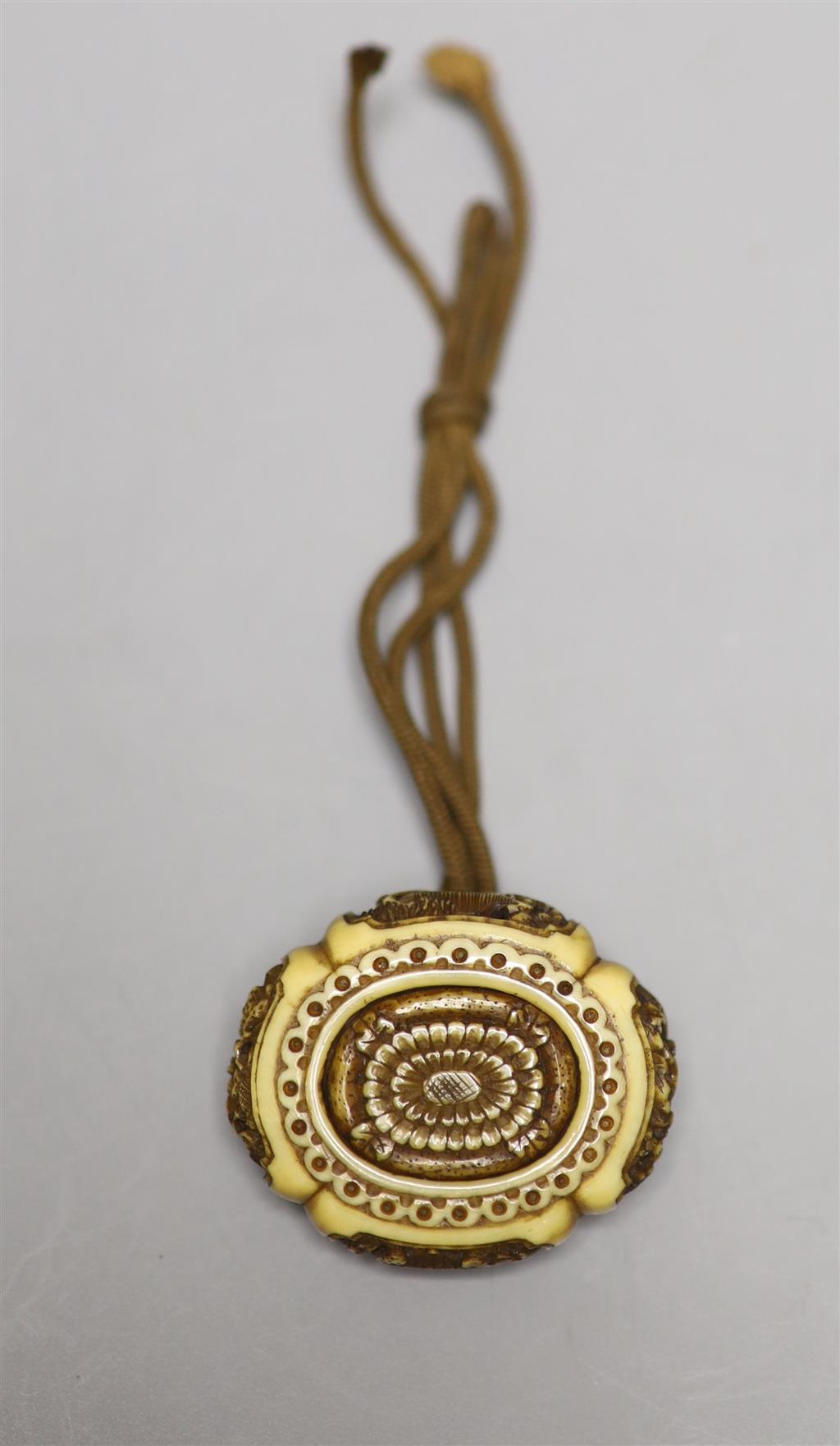 A 19th century ivory manju netsuke